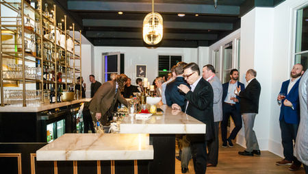 Private event photography for a NADA networking reception with live music.