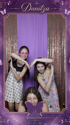 Mirror photo booth setup for a lavender and eggplant quinceañera celebration