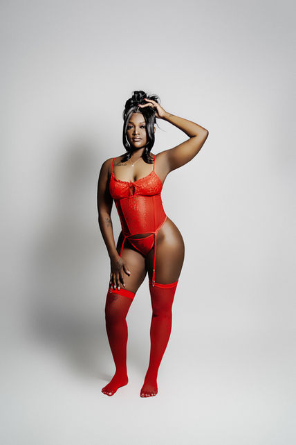 young black girl in red teddy with garter and thigh high stockings