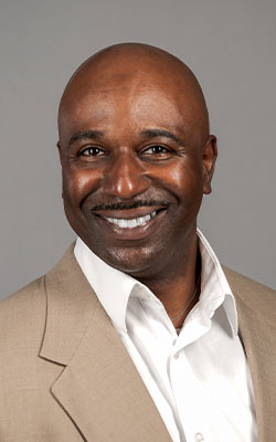 Legal professional wearing a brown blazer for a polished New Orleans branding headshot