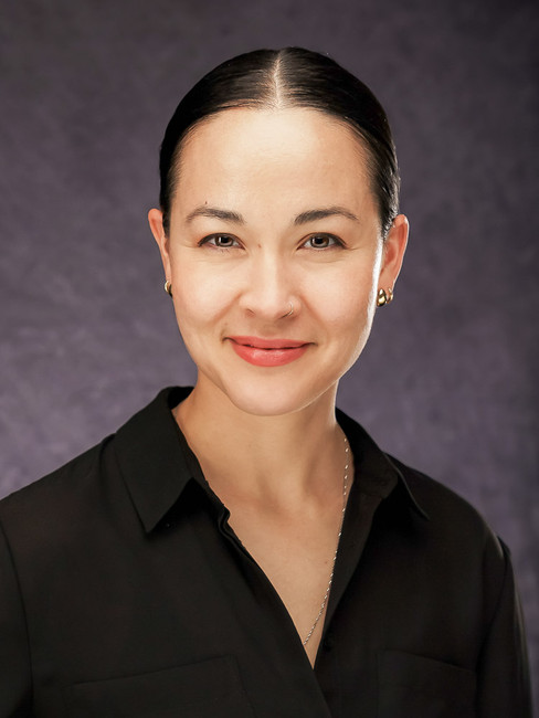 Professional studio headshot of a Latina businesswoman in New Orleans.