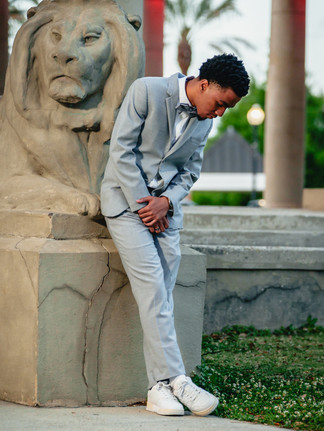 Edna Karr High School prom portrait of young man near City Park statue