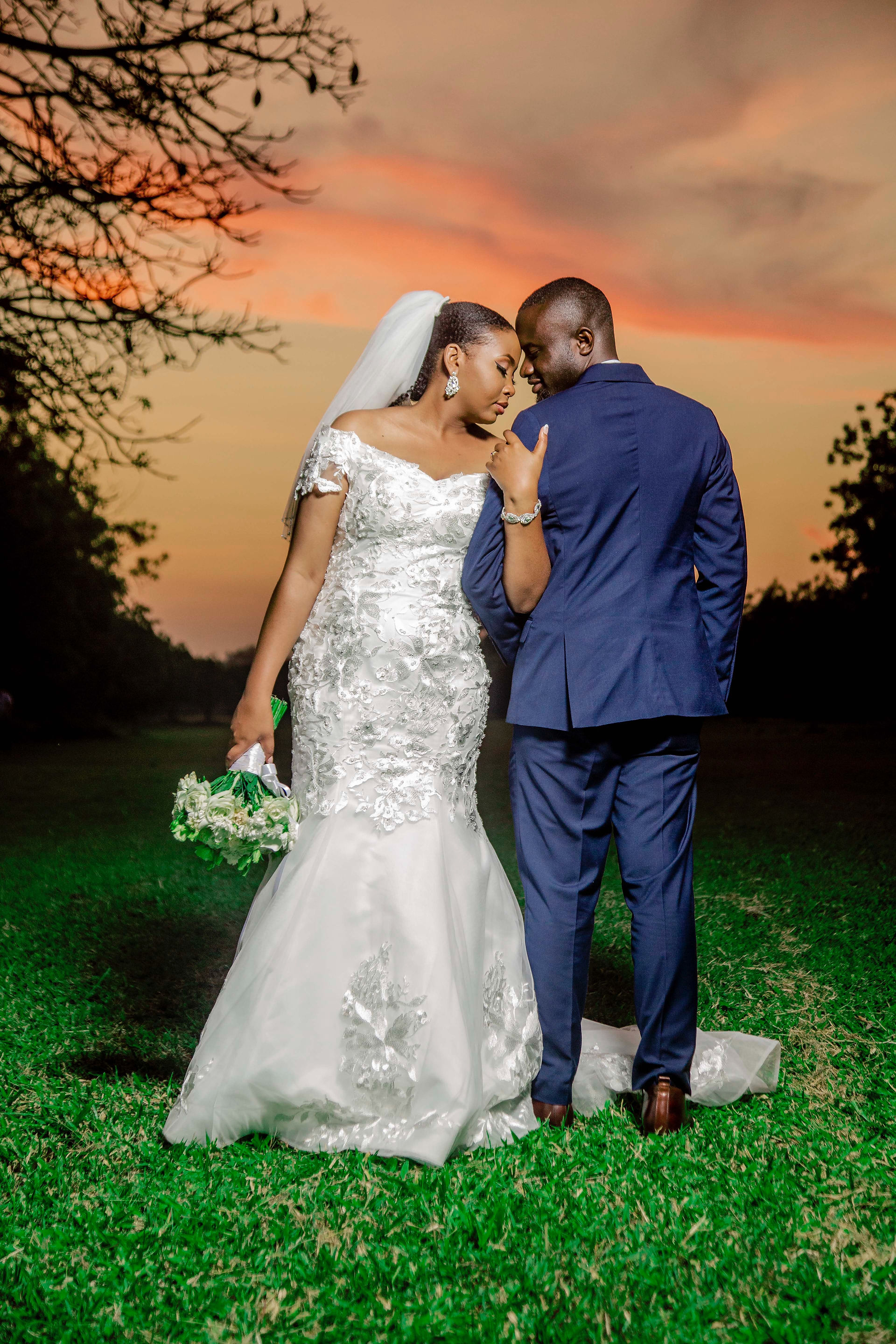 Newlywed couple standing together during a guided New Orleans wedding portrait session