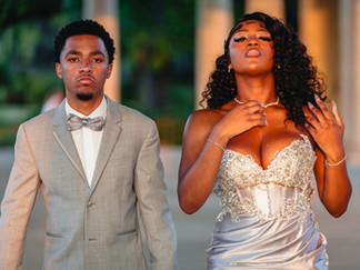 Stylish New Orleans prom couple posing under the Peristyle columns