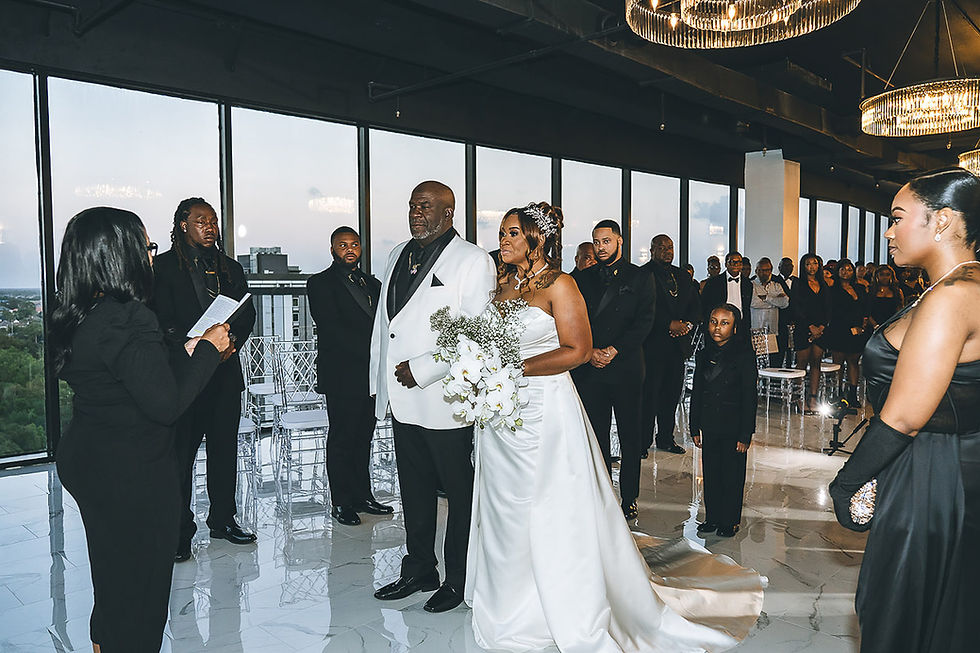 Wedding videography still of a couple exchanging vows in the Lakeview Room at NOLA Skyline Event Center