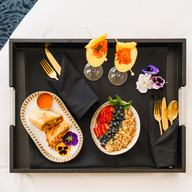 mimosas and yogurt bowl in room dining