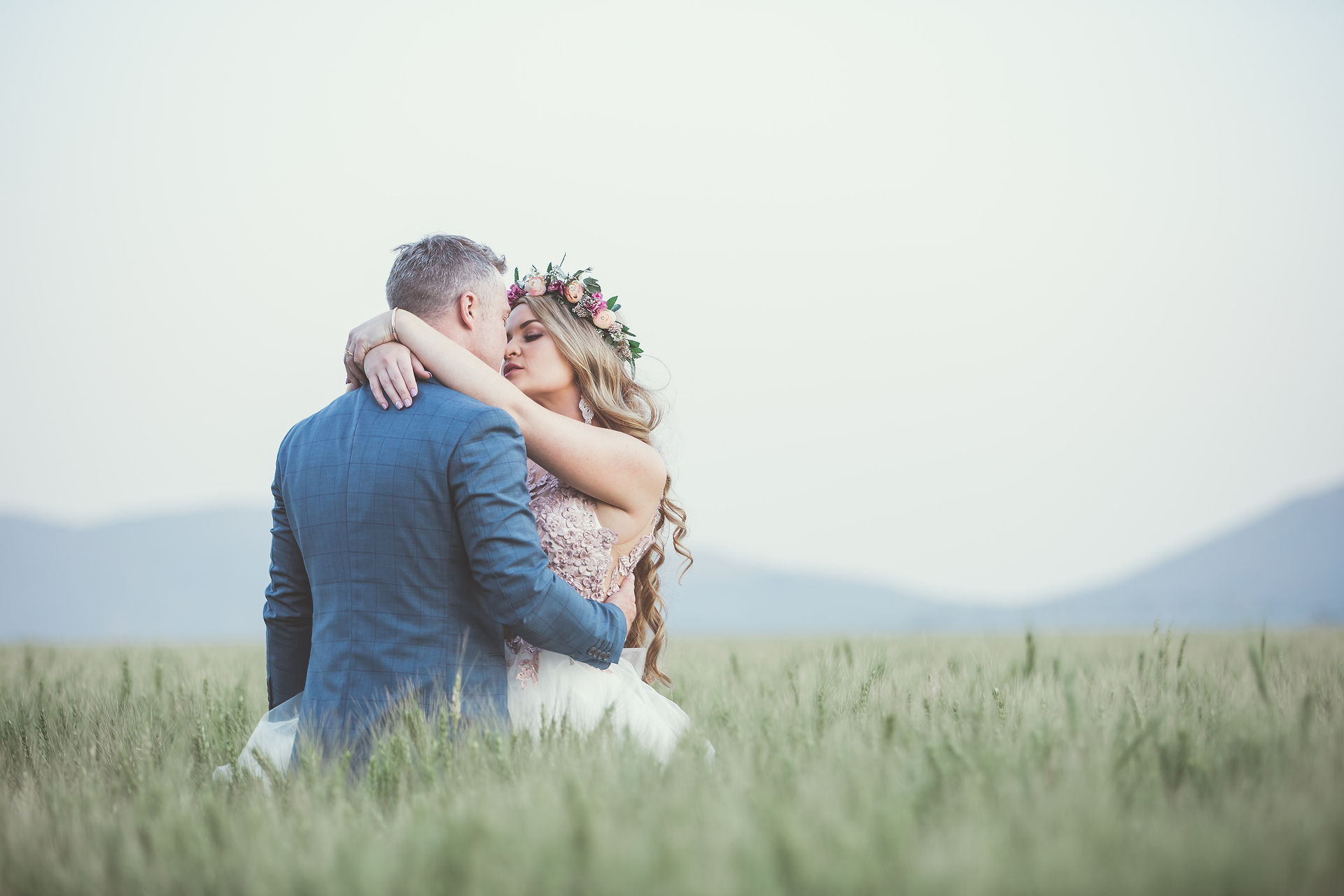 Wedding couple grass field