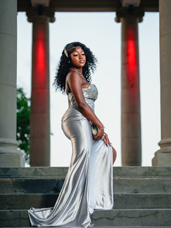 Teen girl prom portrait seated on the steps at City Park Peristyle