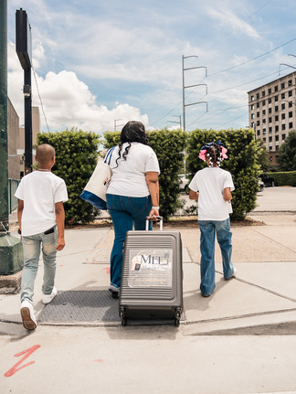 Regina Moore photographed in motion near Caesars New Orleans during her travel agency branding session.