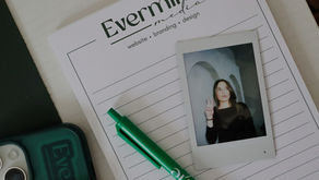 Evermine Media notepad with polaroid of owner Anna DiFiore, with green Evermine Media pen and phone