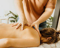 Woman giving a deep tissue massage