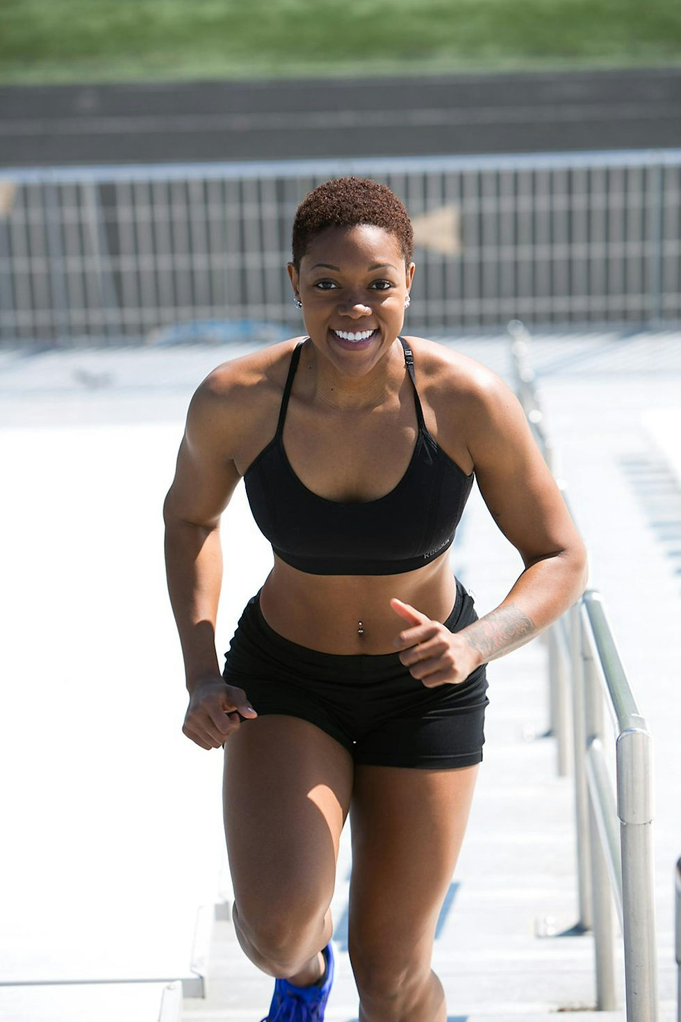 fit-woman-with-short-hair-jogging-outdoors-showing-strength-and-happiness.-936075-scaled.j