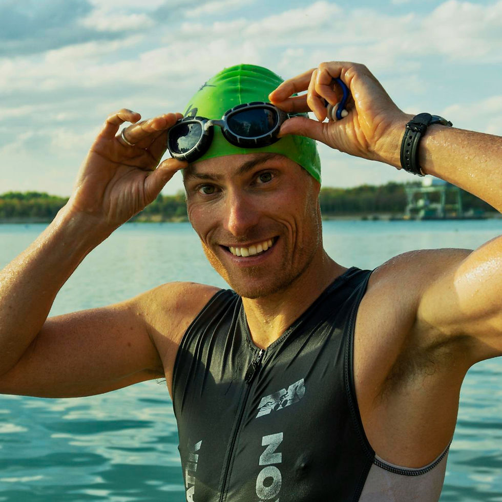 confident-male-athlete-adjusting-goggles-at-a-lake-during-a-sunny-day-ready-for-training_e