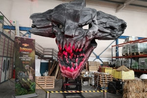 Large scale animatronic stone giant original character in factory testing.