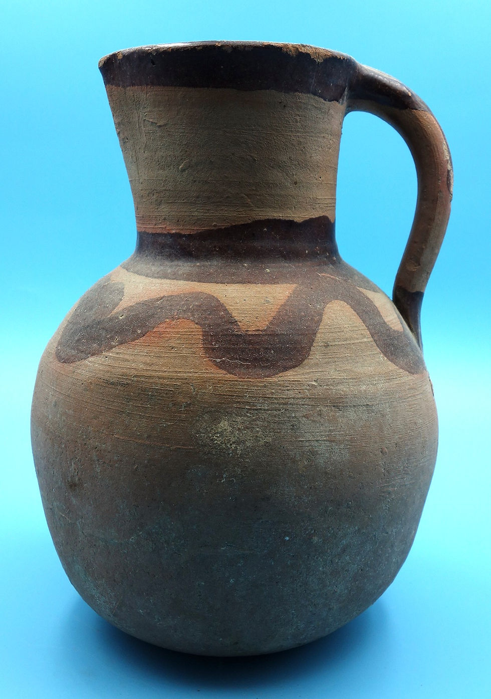 Vintage hand-painted clay jug with a handle