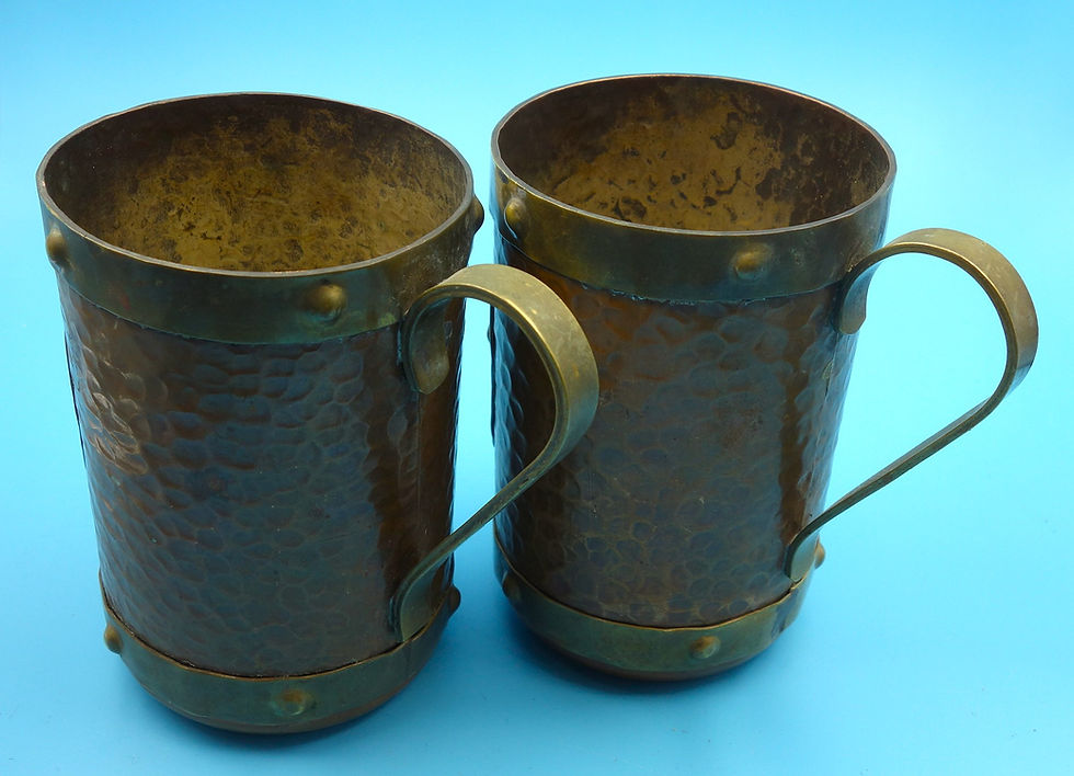 Pair of vintage hammered copper mugs