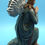 Thumbnail: Kneeling angel figurine, blue robe, praying