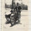 Thumbnail: Man in suit riding vintage motorcycle with sidecar