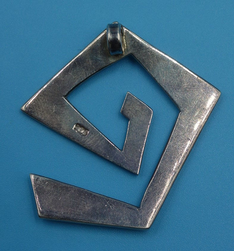 Silver pendant with geometric design