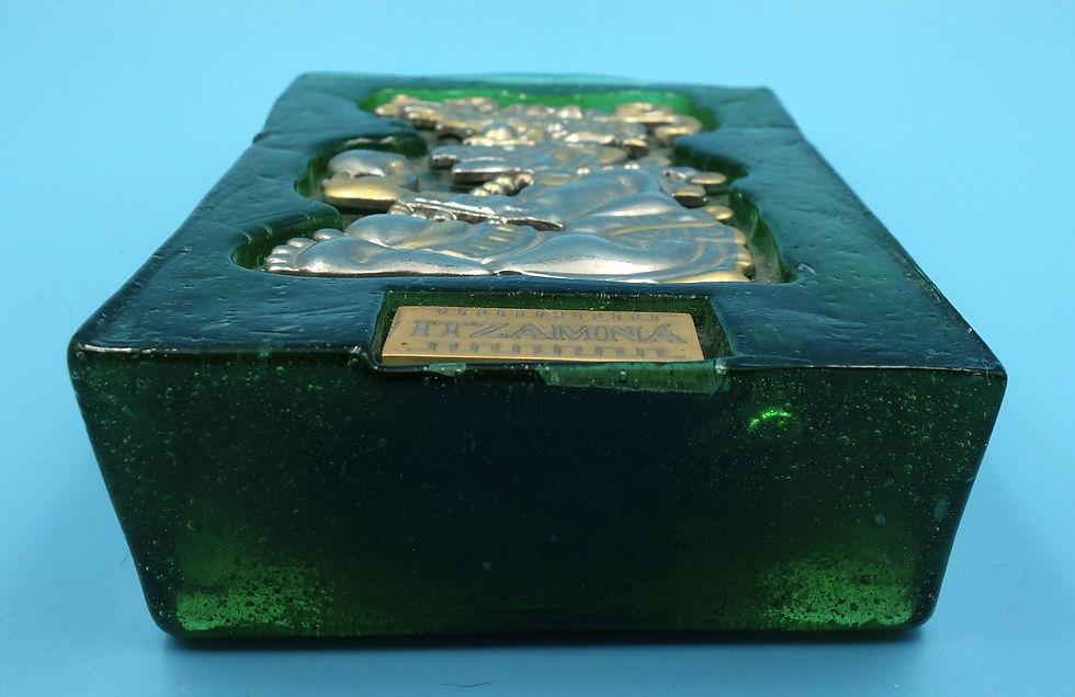 Silver fish bone brooch in green glass