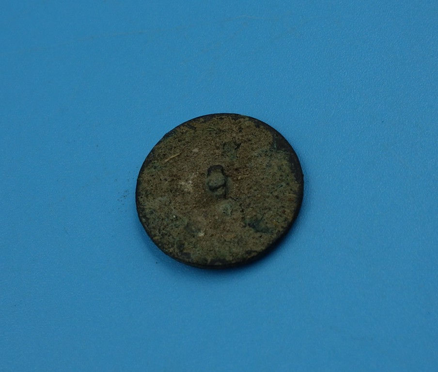 Antique bronze coin, aged patina