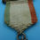 Thumbnail: Vintage military medal with ribbon