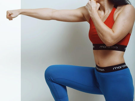 woman with on knee up, high heel, action stance