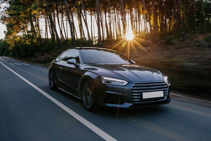 black-sport-car-highway-drive-sunset_114579-5064.jpg