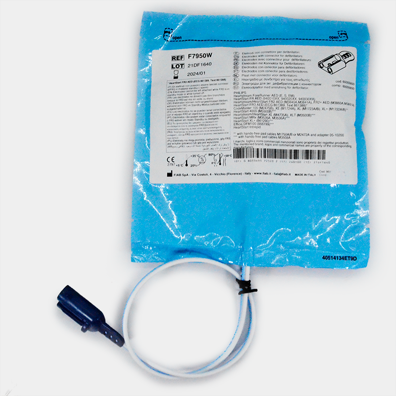 Paquete azul con texto visible y cable conectado. Electrodos multifunción. Ref F7952PW. Empaquetado médico.