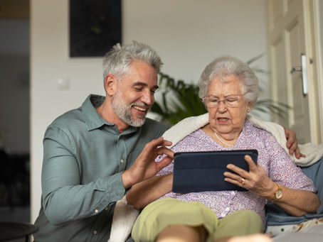 Mother and son looking at ipad