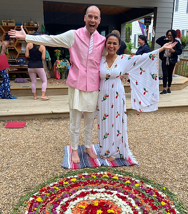 a man and a woman in a yoga teacher graduation with mandala flowers