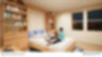 Peaceful bedroom with warm textiles, large window, and decorative Navajo-patterned rug