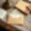 using tans, creams, browns, and peach, create a picture of An Open Envelope or Letter on a