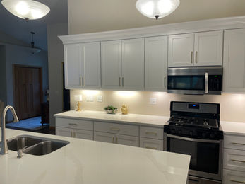 This project was designed in a day and approved to order the same day. There was an existing doorway in the kitchen to the hall that we drywalled over as the homeowners had painters coming the same week. Crown molding was 3¼" on a 4" freeze board. Base around the island was 4½" with a round over to match the door edges. I also did the flooring in this house.