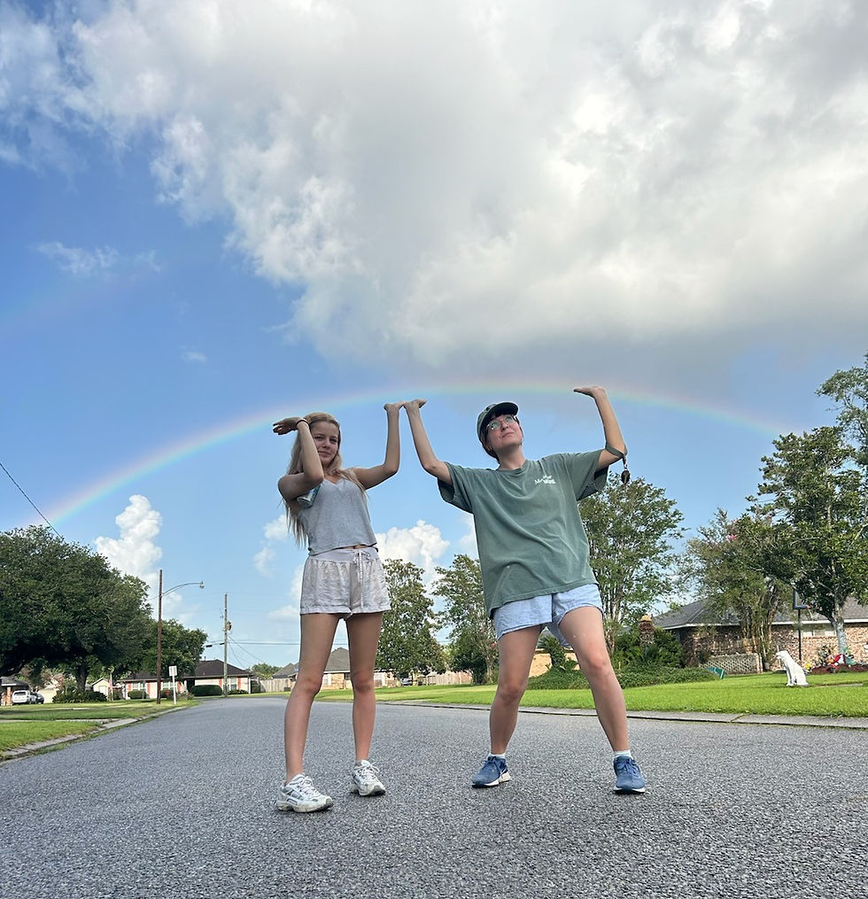I love this picture of my girls trying to hold up a heavy rainbow