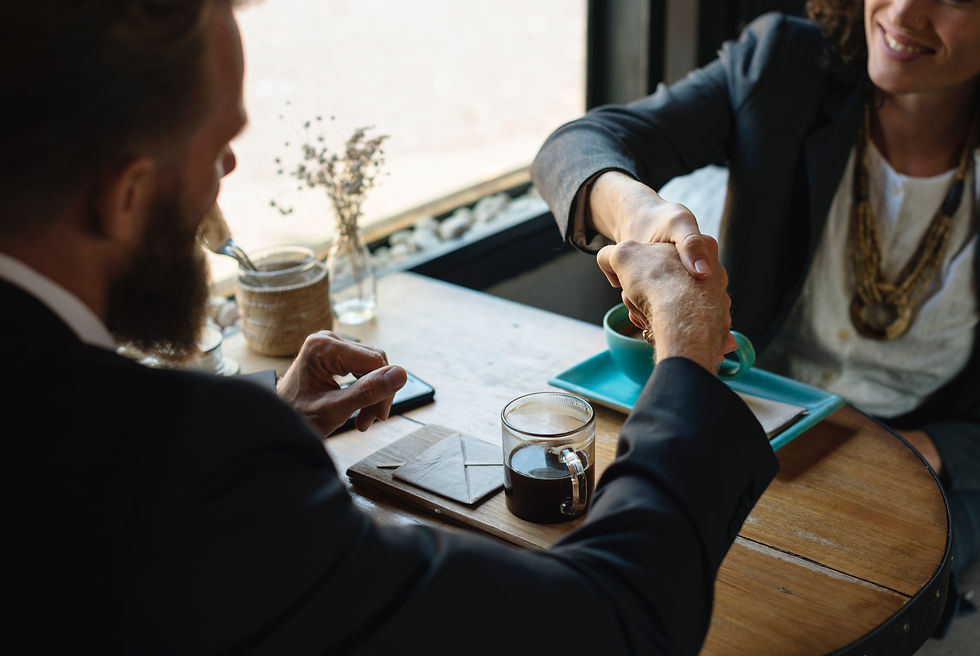 Business People Shaking Hands - Photo by Ian Schneider