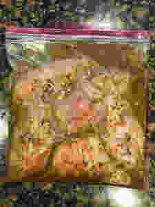 raw chicken marinating in bag