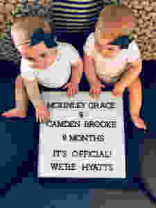 twin girl adoption announcement with sign