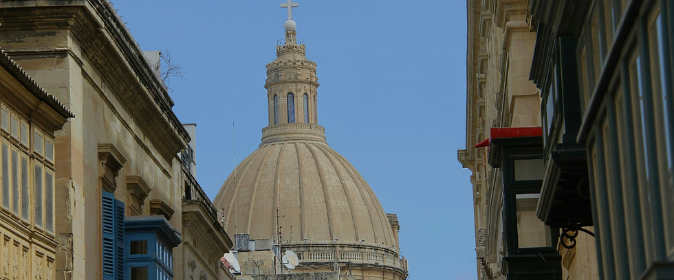 Blue-shuttered building and church dome in Valletta, Malta