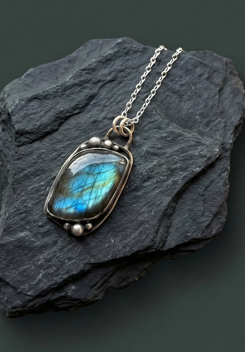 A beautiful handmade necklace with a vibrant blue flash labradorite stone