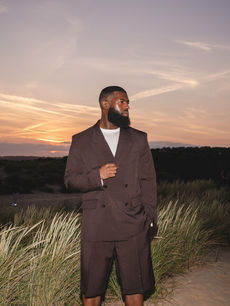 Portrait of a man in a tailored brown suit at sunset during the L’Oreal Men’s Staycation, taken by London events photographer Margot Jakobson for L’Oréal Men Expert’s wellness-focused Modern Man retreat.