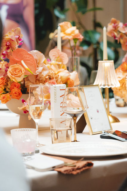 Margot Jakobson, a London event photographer, captures the table setting at the Tandae self tan launch by Georgia Louise. A beautiful floral arrangement and champagne set the mood for this luxurious celebration.