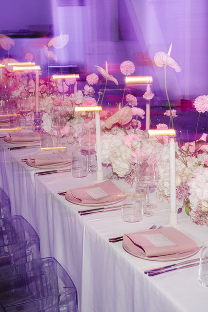 London-based event photographer Margot Jakobson, captures a beautifully decorated table with floral arrangements and candles at Caudalie's Reservation-Lift serum launch event in Dublin, perfect for highlighting the luxurious atmosphere.