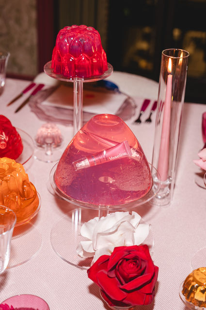 Stylish jelly dessert centrepiece with Vaseline lip gloss product at PR dinner for Vaseline Gluta-Hya Lip Serum Gloss, hosted by Olivia Attwood, photographed by London events photographer Margot Jakobson