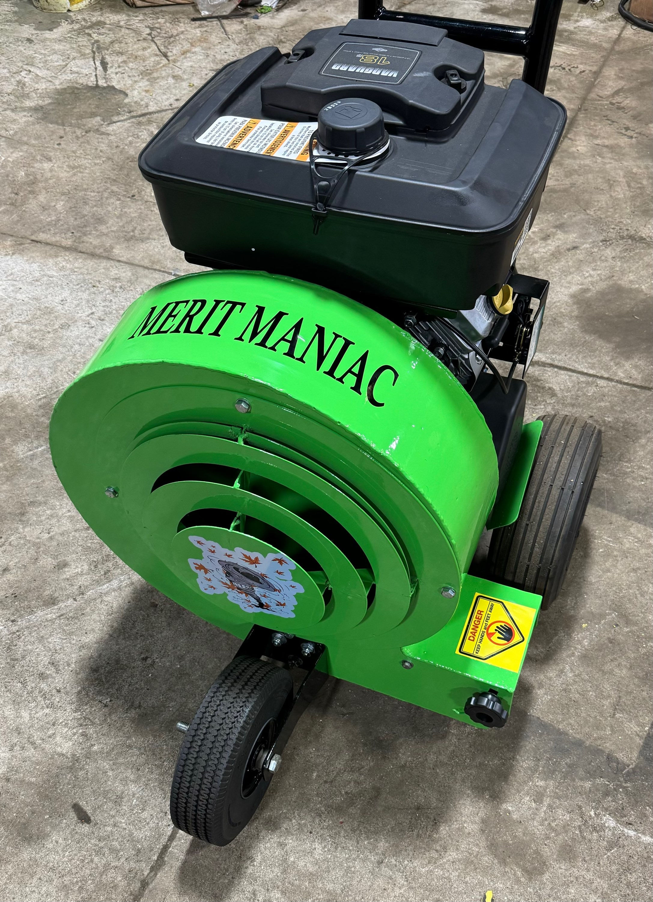 The Merit Maniac 18 hp walk behind push blower