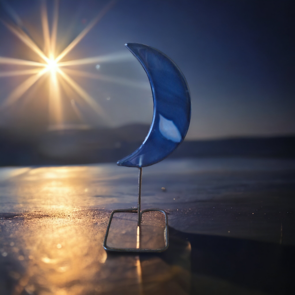 Moon shaped blue agate crystal on stand. 