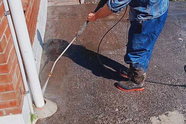 Concrete water blasting on an Auckland property.