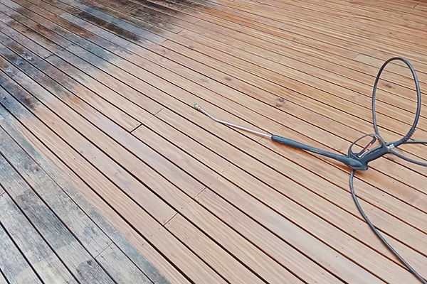 Water blasting progress shown on a deck in Ayckland.