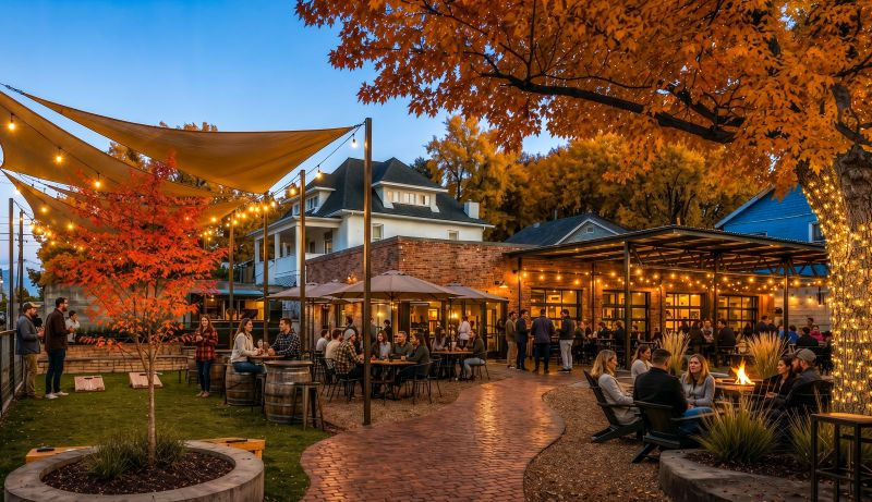 rendering of concept of beer hall for the sloans lake community with autumn colored trees and covered patio filled with guests and patrons of Denver