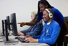 Learning digital skills at a Goodwill Dallas computer lab with career coaching assistance.